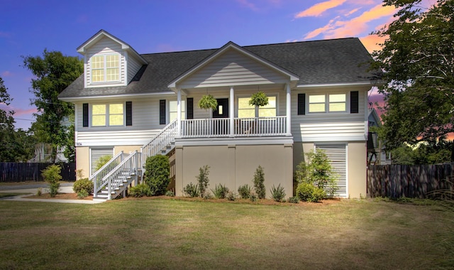 1834 Cornish Ave, Charleston, SC 29412 - view of front of house with fence, stairs, a porch, and a front lawn
