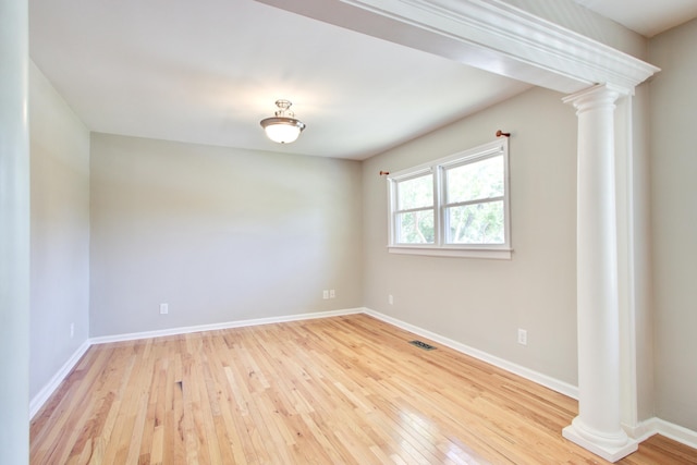 1834 Cornish Ave, Charleston, SC 29412 - empty room featuring baseboards, wood-type flooring, decorative columns, and visible vents