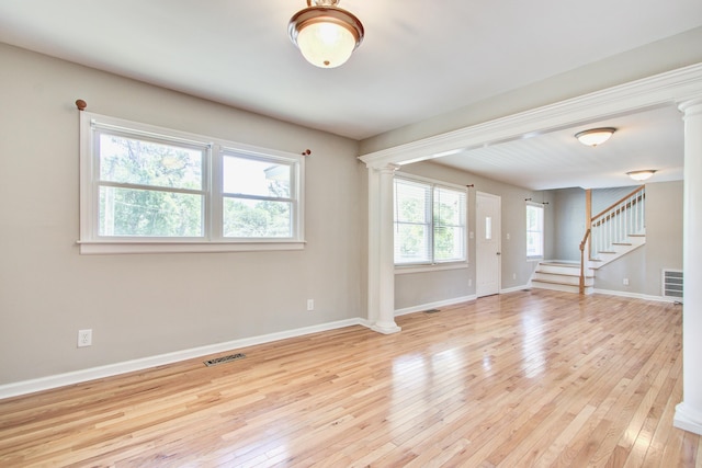 1834 Cornish Ave, Charleston, SC 29412 - interior space with light wood-style flooring, baseboards, ornate columns, visible vents, and stairway