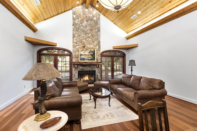 living area with french doors, wood finished floors, wood ceiling, and baseboards