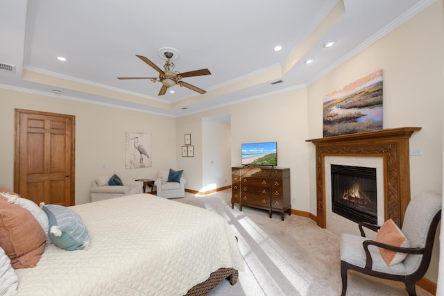 bedroom featuring light carpet, ornamental molding, a raised ceiling, and visible vents