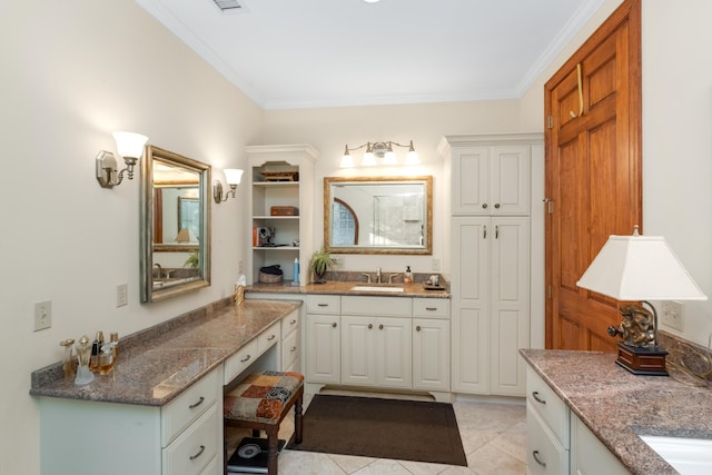 bathroom featuring tile patterned floors, ornamental molding, and vanity