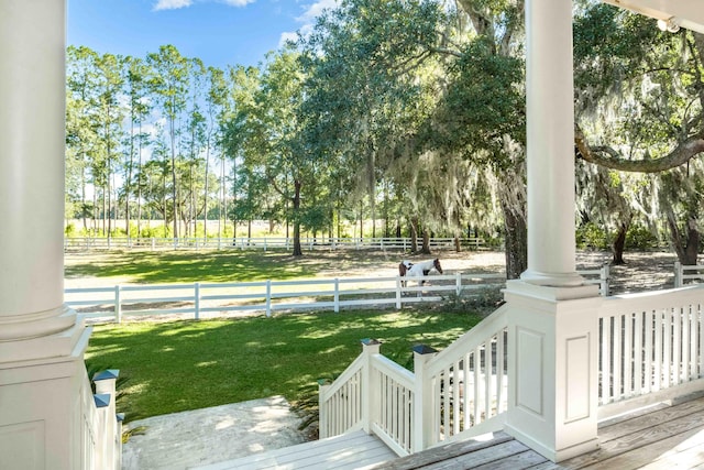 surrounding community featuring fence and a yard