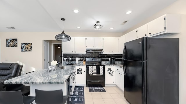 2172 Palermo Pl, North Charleston, SC 29406 - kitchen featuring black appliances, under cabinet range hood, a sink, white cabinetry, and light stone counters