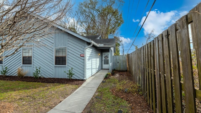 2172 Palermo Pl, North Charleston, SC 29406 - view of home's exterior with a fenced backyard and a chimney