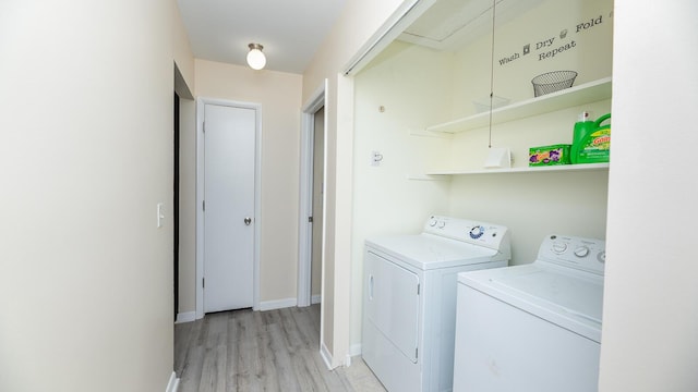 2172 Palermo Pl, North Charleston, SC 29406 - laundry area with washer and clothes dryer, light wood-type flooring, and baseboards