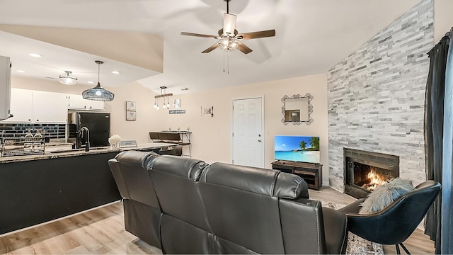 2172 Palermo Pl, North Charleston, SC 29406 - living room featuring ceiling fan, light wood-type flooring, a fireplace, vaulted ceiling, and recessed lighting