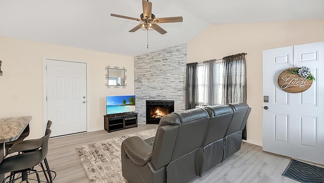 2172 Palermo Pl, North Charleston, SC 29406 - living area with ceiling fan, lofted ceiling, a fireplace, light wood-style flooring, and baseboards