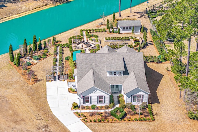 birds eye view of property featuring a water view