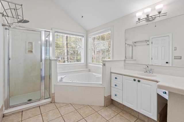 full bathroom featuring lofted ceiling, a notable chandelier, a jetted tub, and a stall shower