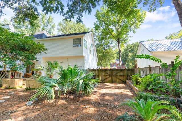 view of side of home with fence