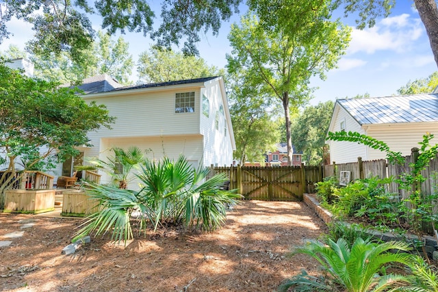 view of side of home with fence