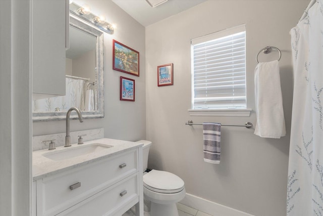 full bathroom with toilet, baseboards, and vanity