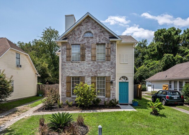 front facade featuring a front yard