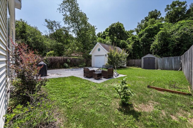 view of yard with a patio and a shed