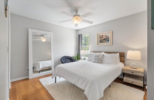 bedroom featuring ceiling fan and light hardwood / wood-style floors