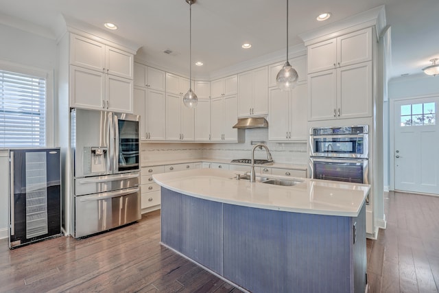 kitchen with wine cooler, white cabinets, hardwood / wood-style floors, pendant lighting, and stainless steel appliances