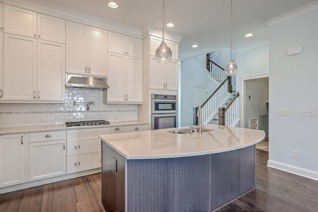 kitchen with white cabinetry, hanging light fixtures, and dark hardwood / wood-style floors