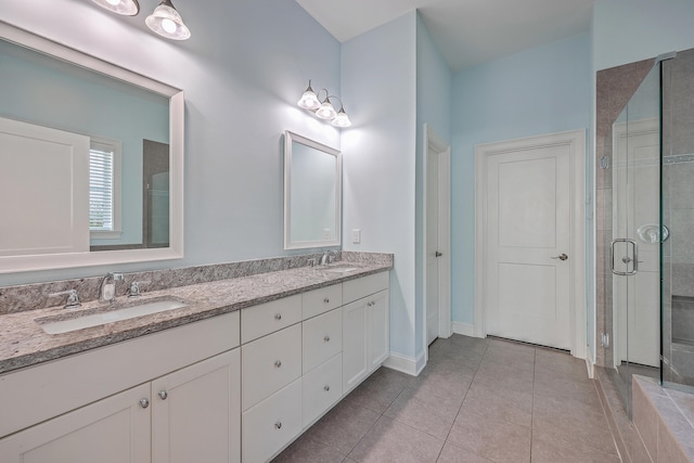 bathroom with vanity, tile patterned floors, and walk in shower