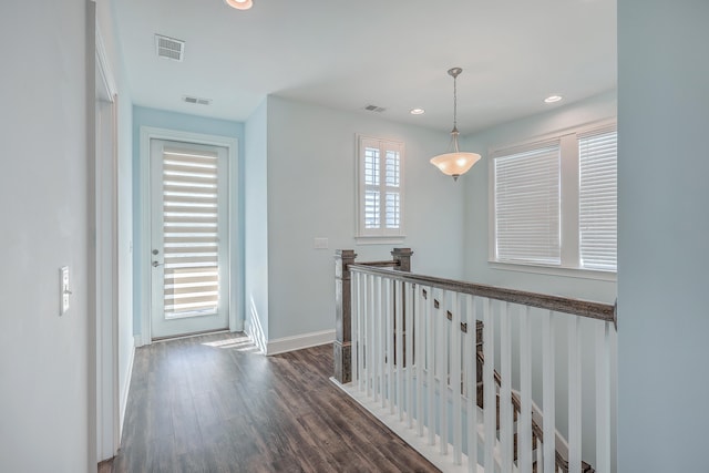 hallway with dark hardwood / wood-style flooring