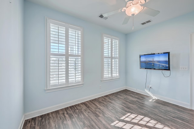 spare room featuring ceiling fan and hardwood / wood-style flooring