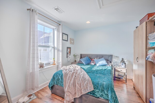 bedroom featuring light hardwood / wood-style floors