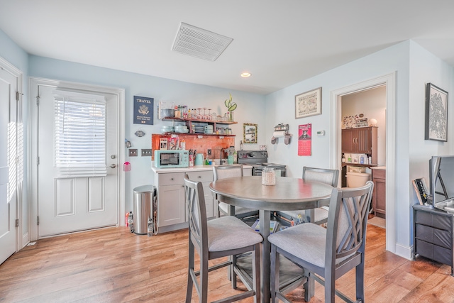 dining room featuring light hardwood / wood-style flooring