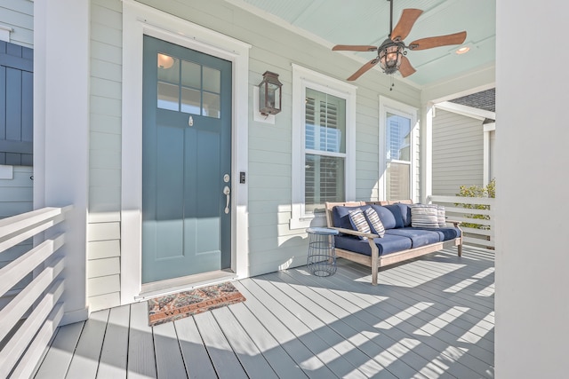 property entrance with ceiling fan