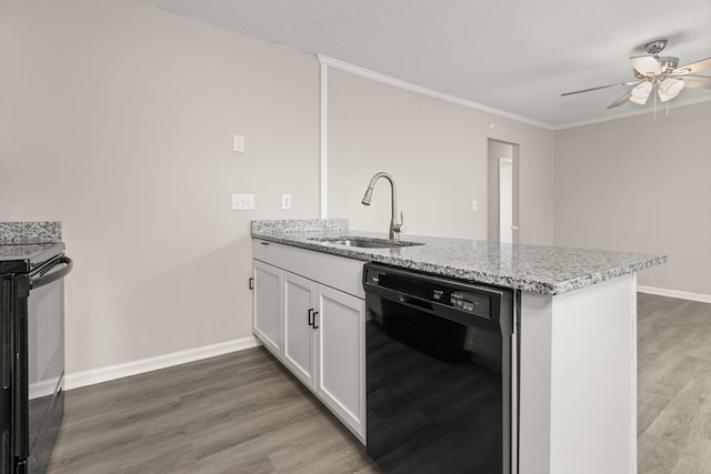 kitchen featuring light stone counters, crown molding, sink, black appliances, and white cabinetry