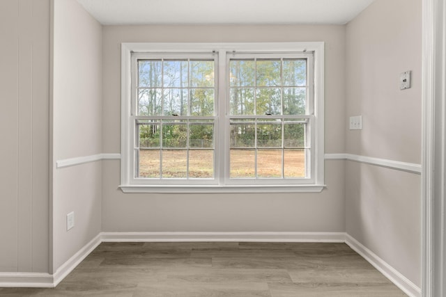 spare room featuring light hardwood / wood-style floors