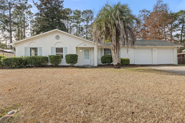 single story home with a front lawn and a garage