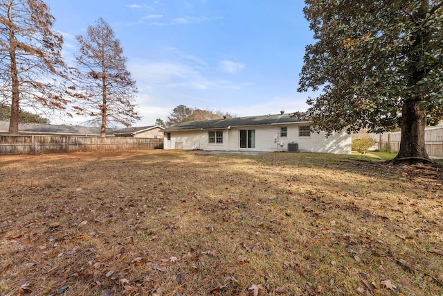 rear view of property featuring central AC