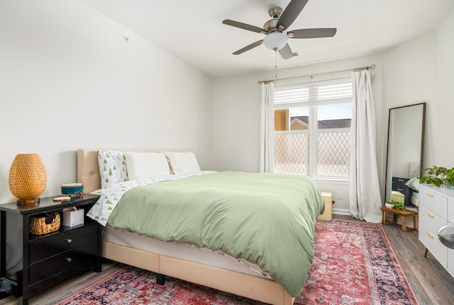 bedroom featuring dark hardwood / wood-style flooring and ceiling fan