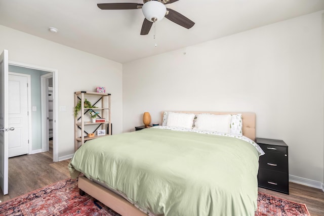 bedroom with ceiling fan and dark hardwood / wood-style flooring