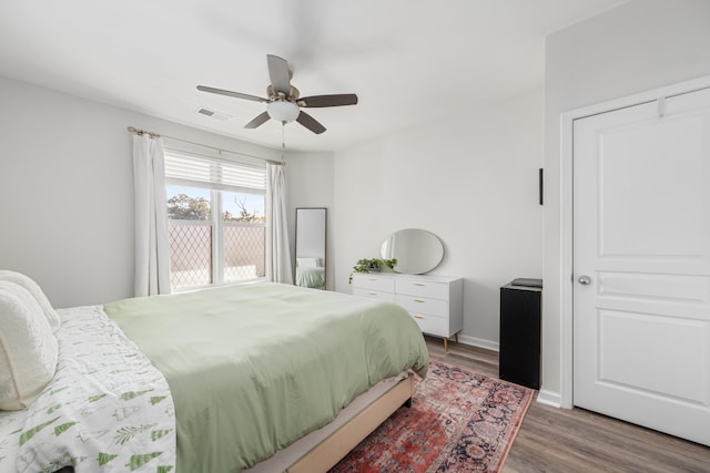 bedroom featuring hardwood / wood-style flooring and ceiling fan