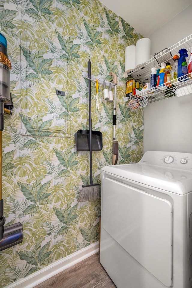 laundry area with washer / dryer and hardwood / wood-style floors