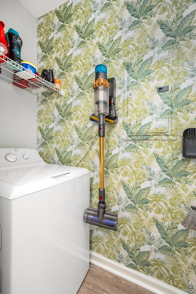 laundry area with washer / dryer and hardwood / wood-style flooring