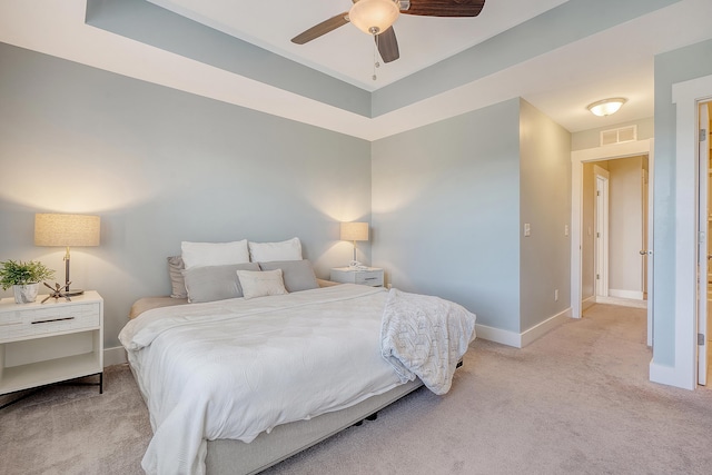 bedroom with ceiling fan, carpet floors, visible vents, and baseboards