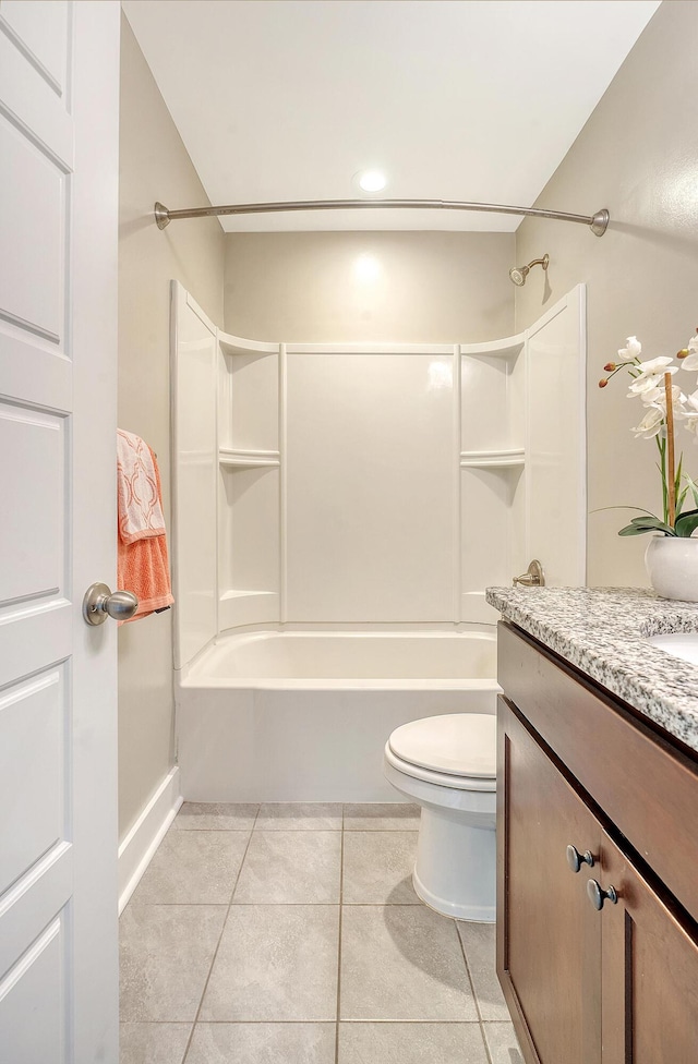 bathroom featuring shower / bathtub combination, vanity, toilet, and tile patterned floors