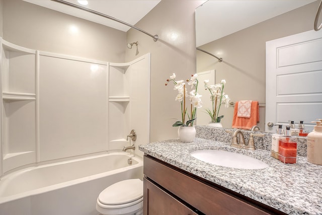 bathroom featuring shower / washtub combination, vanity, and toilet