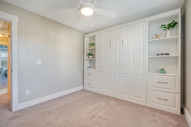 unfurnished bedroom featuring a ceiling fan, carpet, a closet, and baseboards