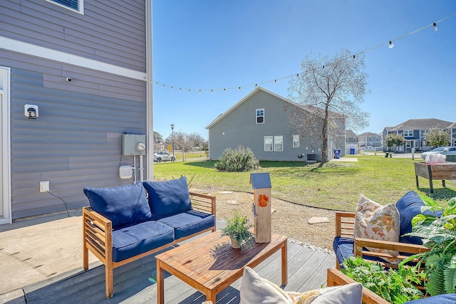 view of patio featuring central AC, a wooden deck, and an outdoor living space