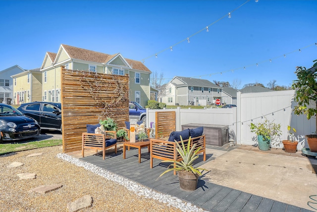 exterior space featuring fence and a residential view