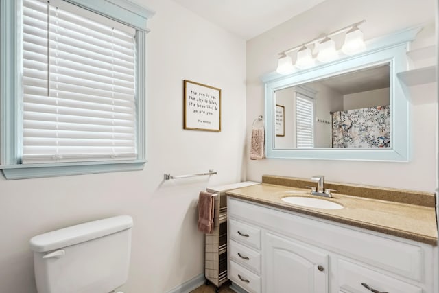 full bath featuring toilet and vanity