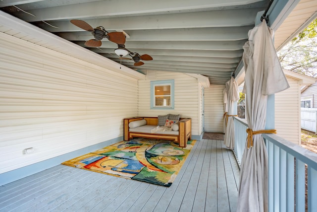 wooden terrace featuring ceiling fan