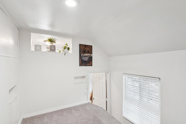 bonus room featuring vaulted ceiling, carpet floors, and baseboards