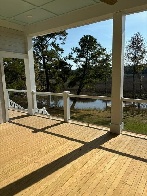 wooden terrace with a water view