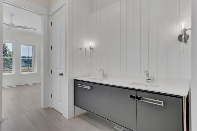 bathroom featuring ceiling fan and vanity