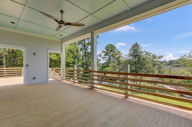 wooden deck featuring ceiling fan