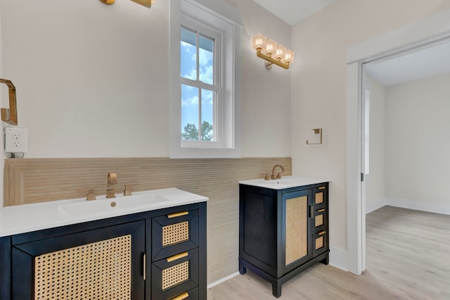 bathroom featuring hardwood / wood-style floors, vanity, and plenty of natural light